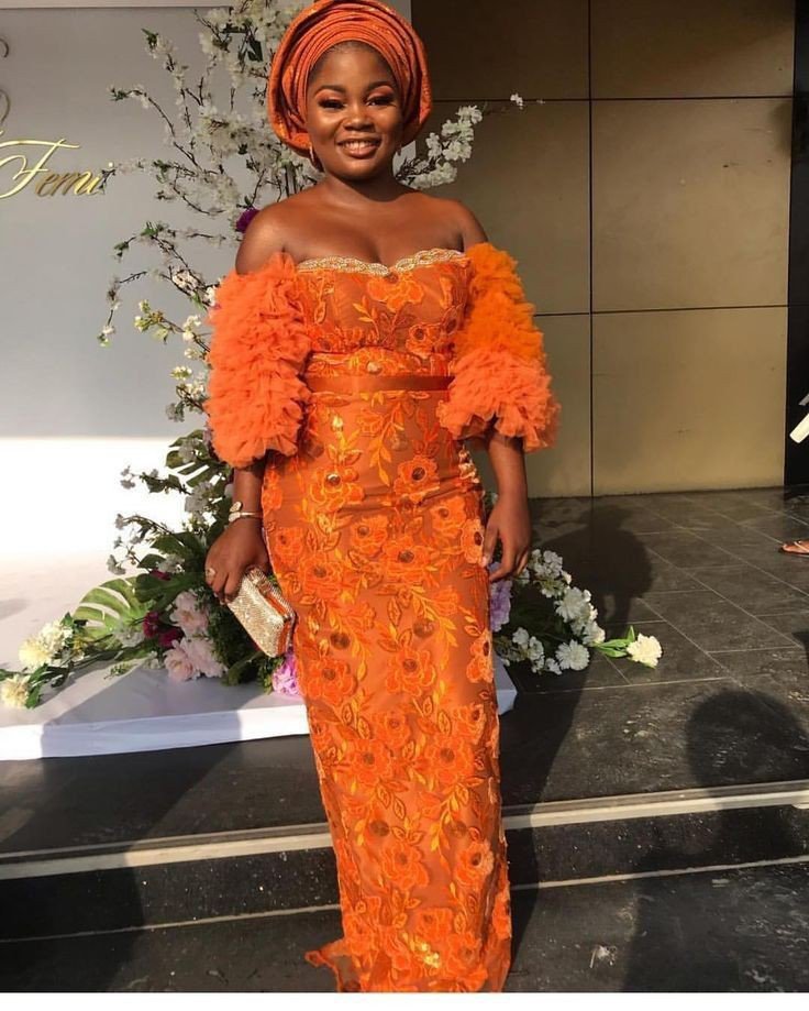 Orange lace gown with net sleeeve