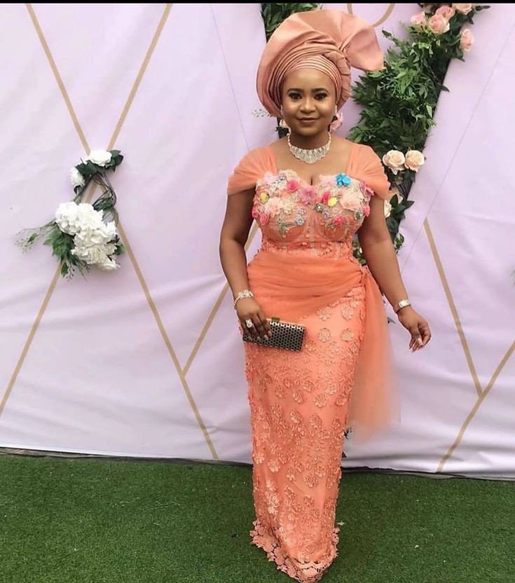 peach lace gown with flower design at bust